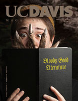 Cover photo: A student looks surprised by a werewolf hand reaching from her book to her face. Book title reads Bloody good literature.