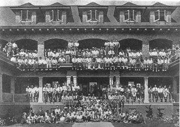 Photo: Group portrait of student residents on porch and balcony of West Hall