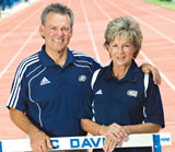 Photo: Jon and Dee Vochatzer standing by hurdle on track