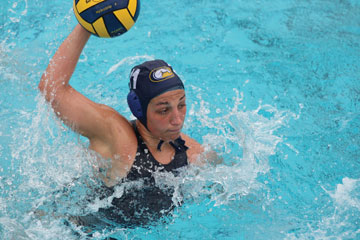 Photo: Water polo player, in pool, about to throw ball