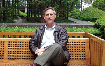 Photo: Russ Wilder, sitting outside on a bench