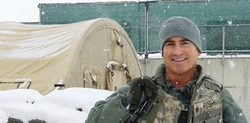 Photo: Gorell, wearing military garb, smiling in snow in Kabul, Afghanistan