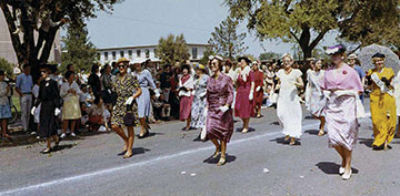 Young female students dressed in clothing of different eras