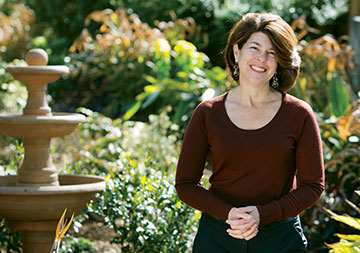 the former patient standing in a garden