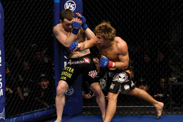 Photo: Urijah Faber punching Jens Pulver