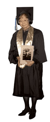 Photo: Arlene Ikemoto Lawrence holding framed photo of her uncle Arlene Ikemoto Lawrence in cap and gown, holding portrait of uncle