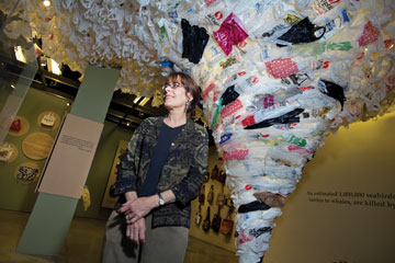 Photo: Savageau standing near plastic bag "tornado"