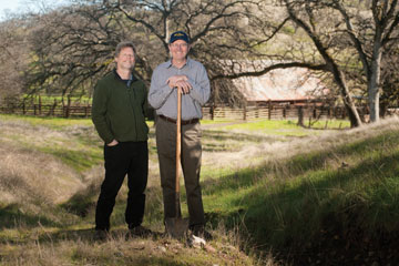 Photo: Randy Dahlgren and Kenneth Tate with shovel on grassland