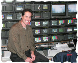Photo: smiling producer/director in TV control room