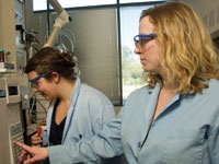 Two female students with scientific instruments in a food science lab at UC Davis