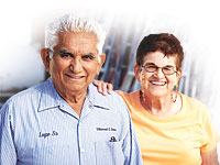 Older Latino couple, smiling