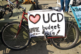 Photo: Parked bike bears sign: Heart UCD, Hate Budget Cuts!"
