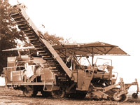 An historic image of a mechanized tomator harvester developed by UC Davis researchers