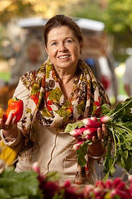 The author holding fresh veggies