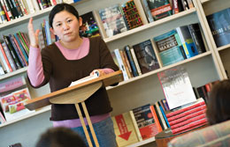Li giving a reading after her book, The Vagrants" was published