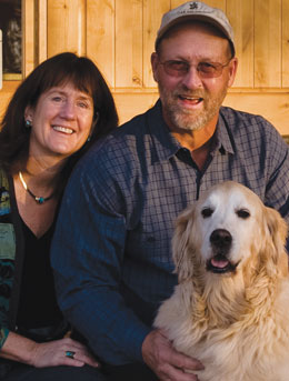 Photo: couple and retriever on winery porch
